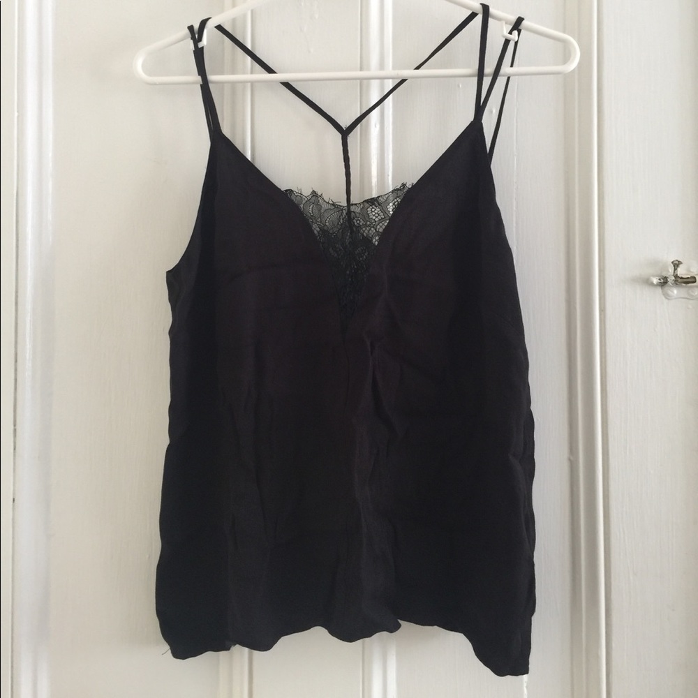 Crepe top, with lace and braided detailing.
