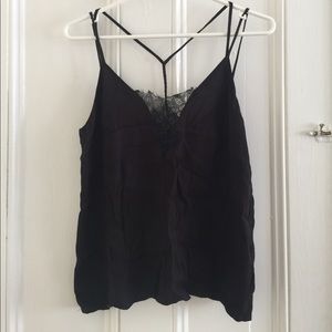 Crepe top, with lace and braided detailing.