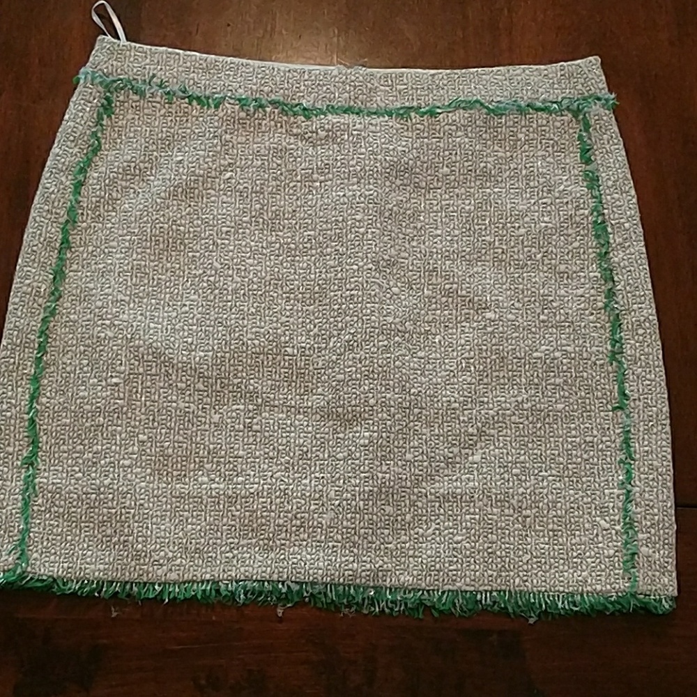 Tweed mini skirt with bright green fringe