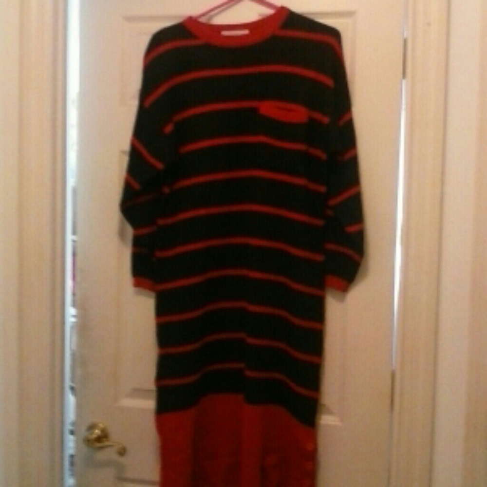 Black sweater dress with horizontal pink stripes.