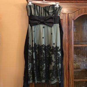 Green cocktail dress with black lace overlay