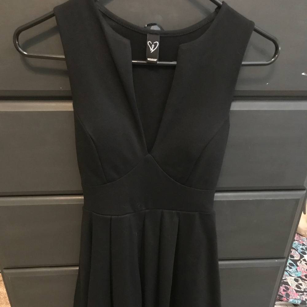 Little black dress with deep V-neck. Padded