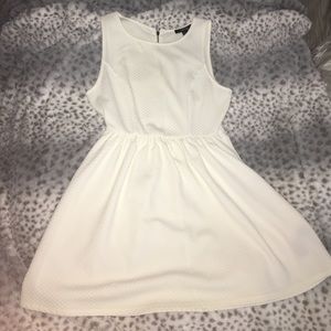 Cream colored textured peplum dress