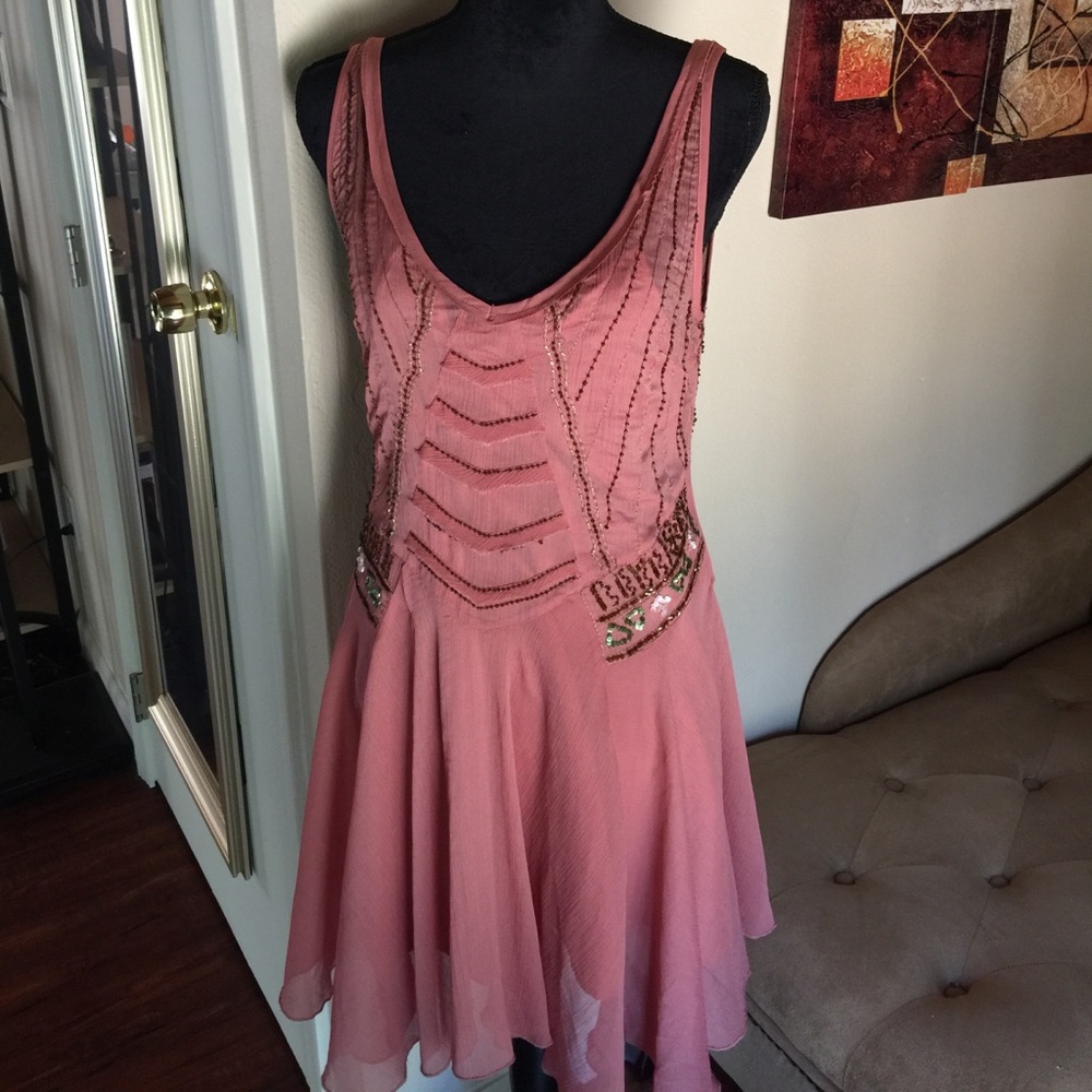 Very unusual Free people peach embellished dress.