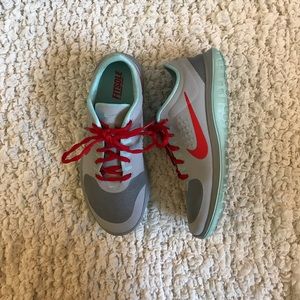 Grey and red Nike Fitsole