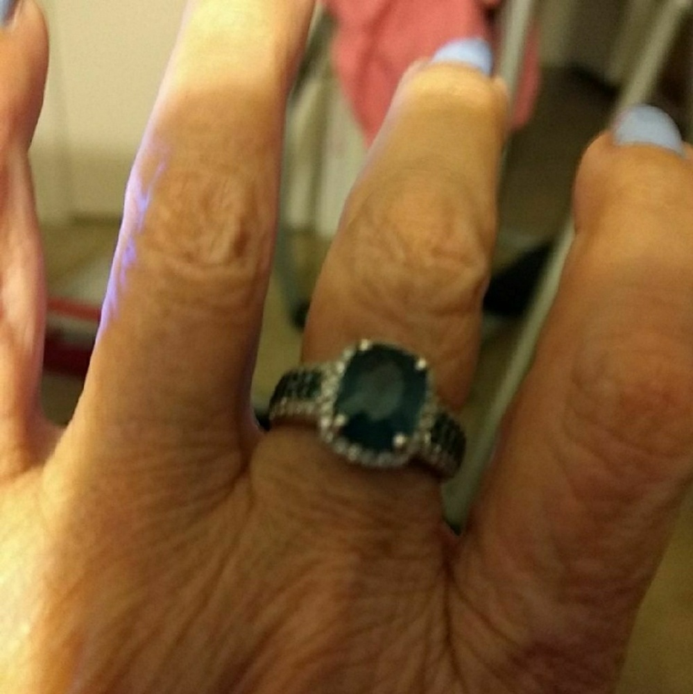 Topaz with clear diamonds surrounding it