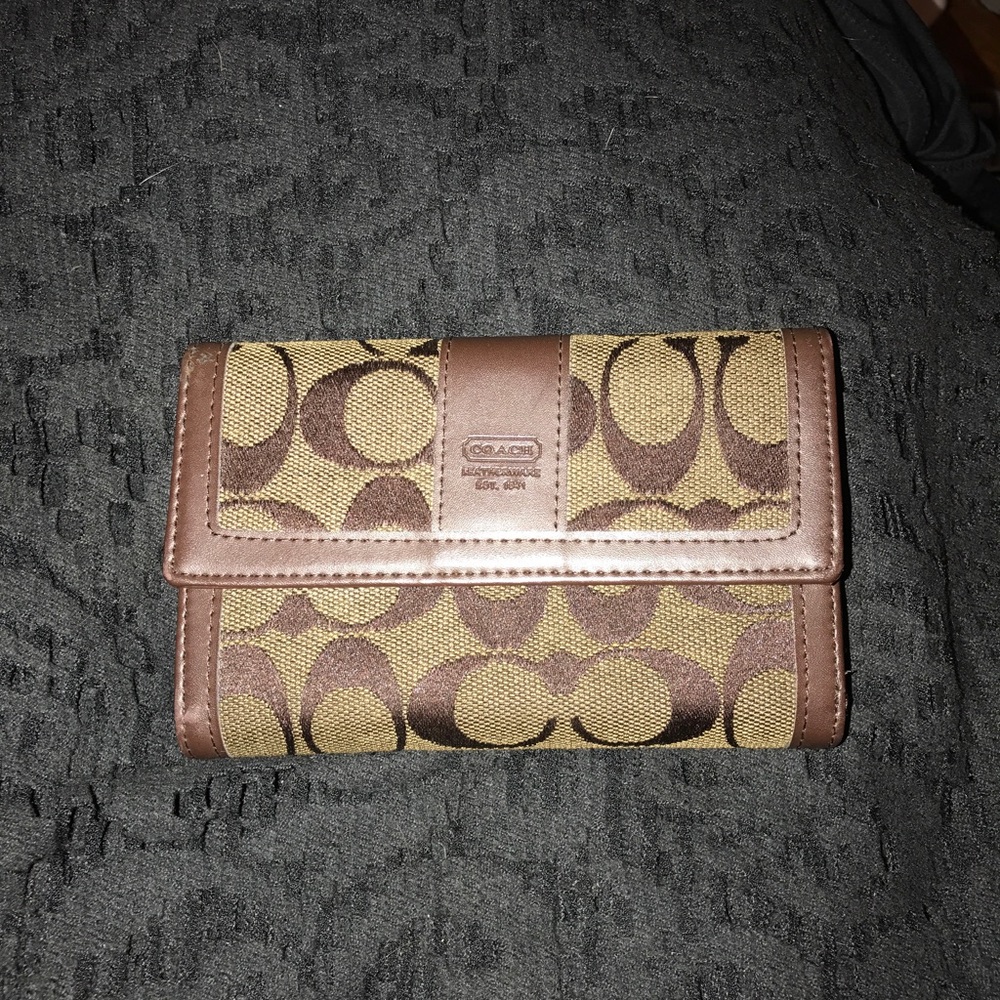 Brown tri fold coach wallet