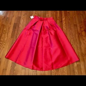 Satin sheen ankle length skirt with bow on front