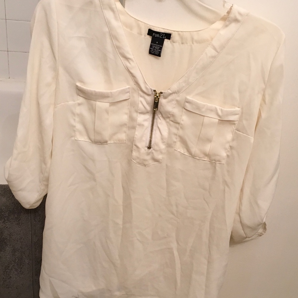 A cream colored blouse