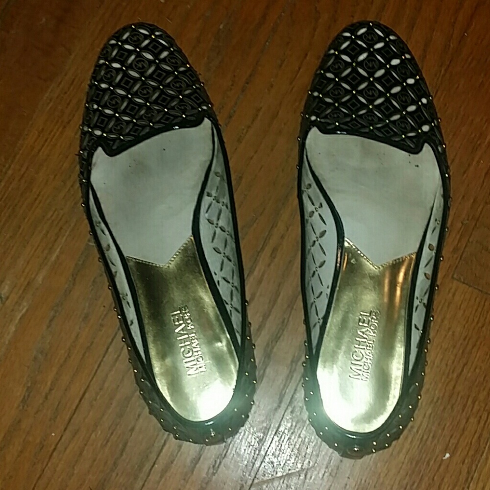 Black perforated gold studded Micheal kors flats