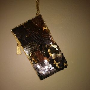 A gold sequence cluch purse.