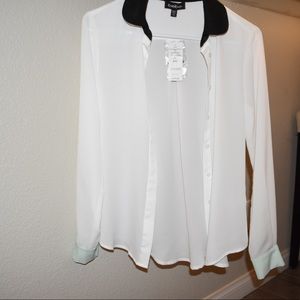 White blouse with black and mint details