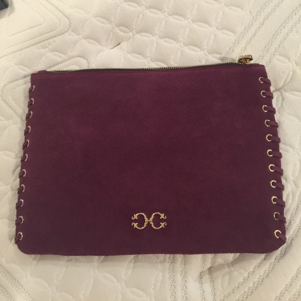 Maroon/purple suede clutch by Wonder