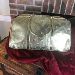 BCBG large overnighter bag . Gold Metallic