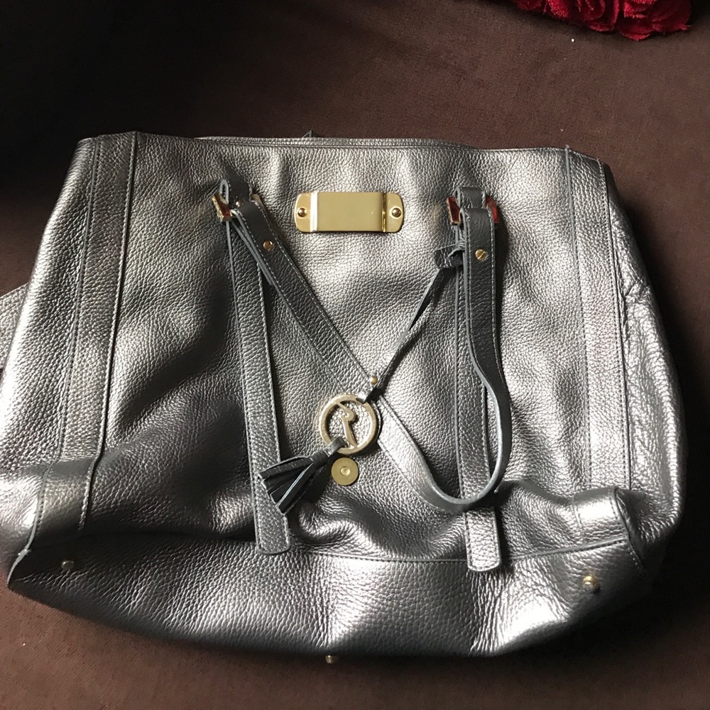Varrlale metallic silver large hand bag.
