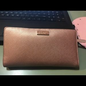 Kate Spade bi-fold rose gold wallet
