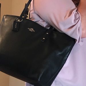 Black gently used Coach handbag.