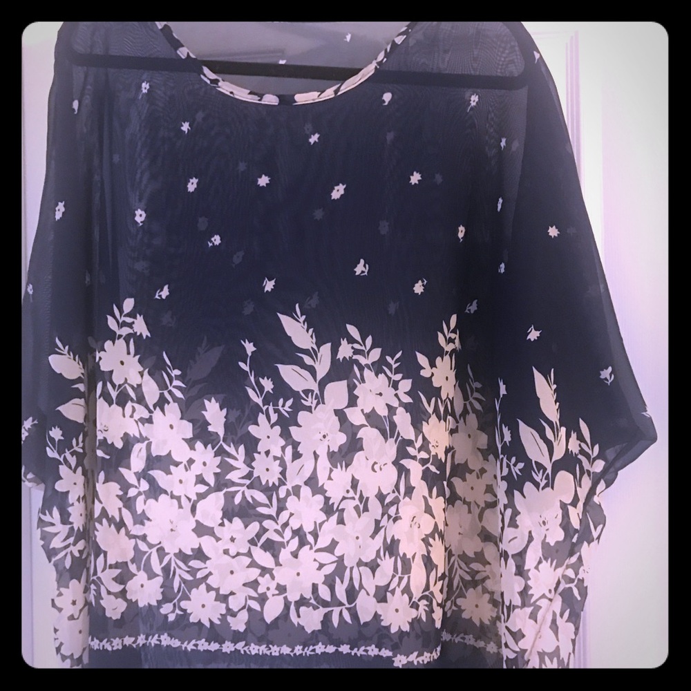 Loose fit blouse/camisole. Sheer.