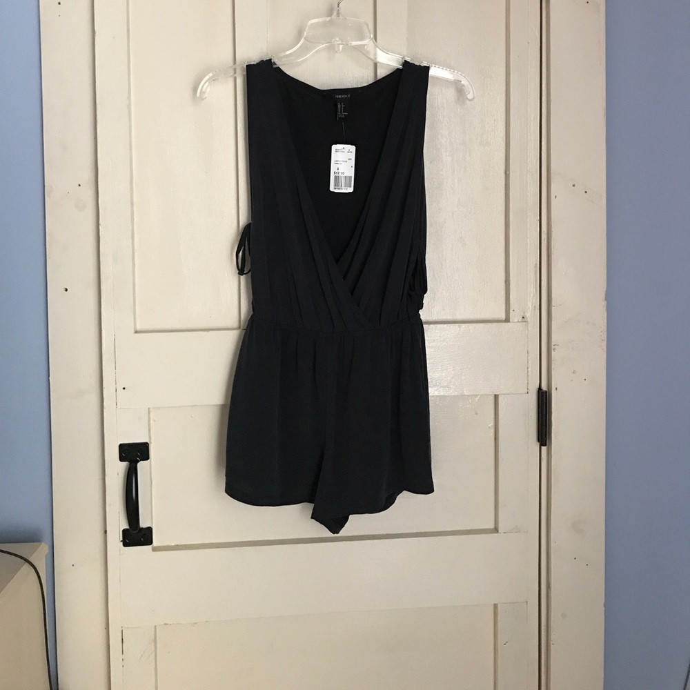 Size small black romper new with tags!