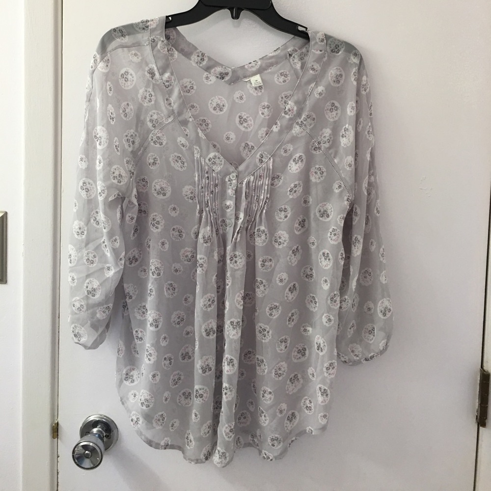 Loose fitting blouse, see through.