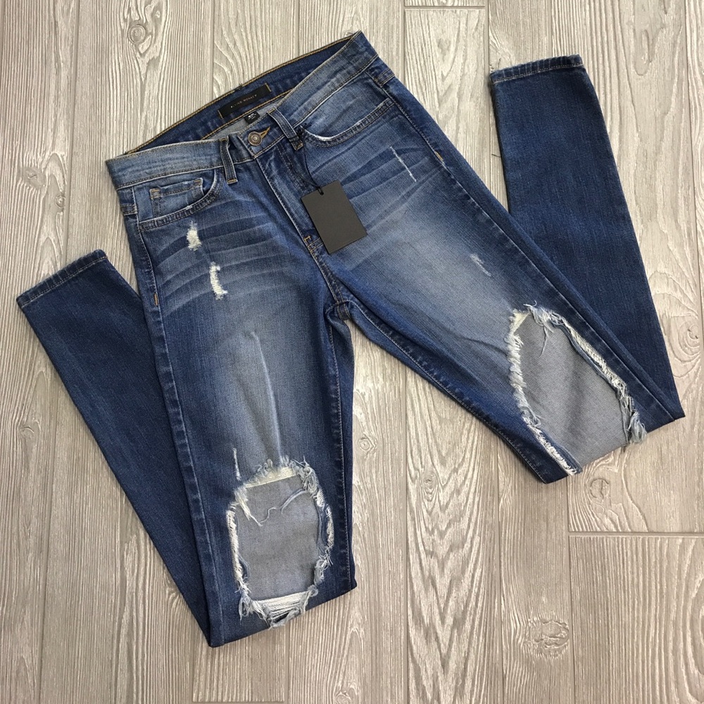 Size 26 holey skinnies