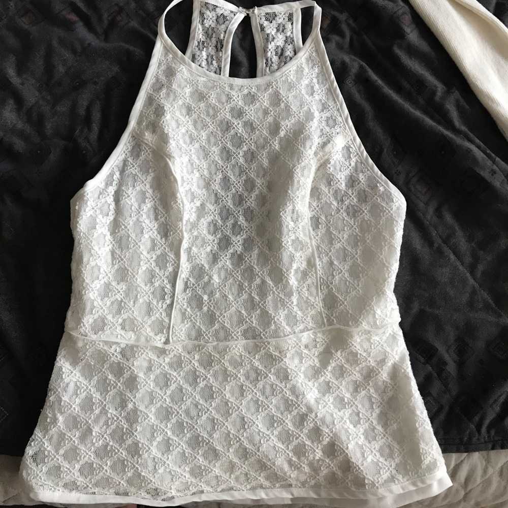 sleeveless delicate top with a lace overlay