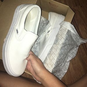 White canvas slip on vans