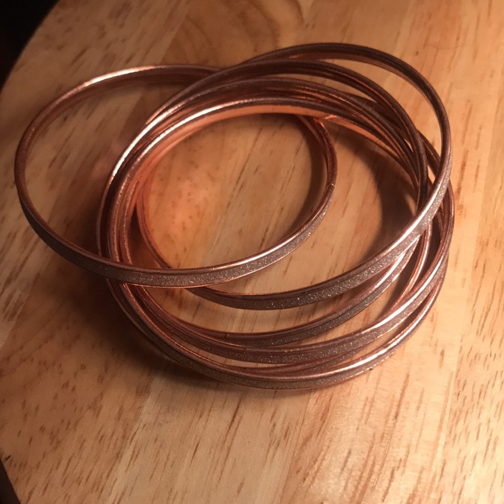 Charming Charlie rose gold and star dust bangles