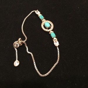 GORGEOUS ELEVATOR BRACELET WITH TURQUOISE STONES.