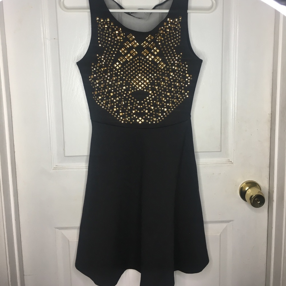 Black dress with gold studs & sheer open back