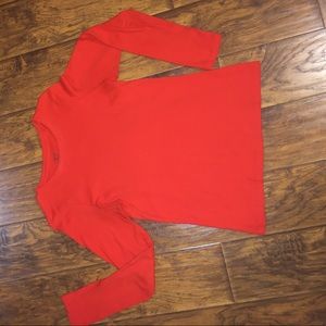 A orange long sleeve shirt