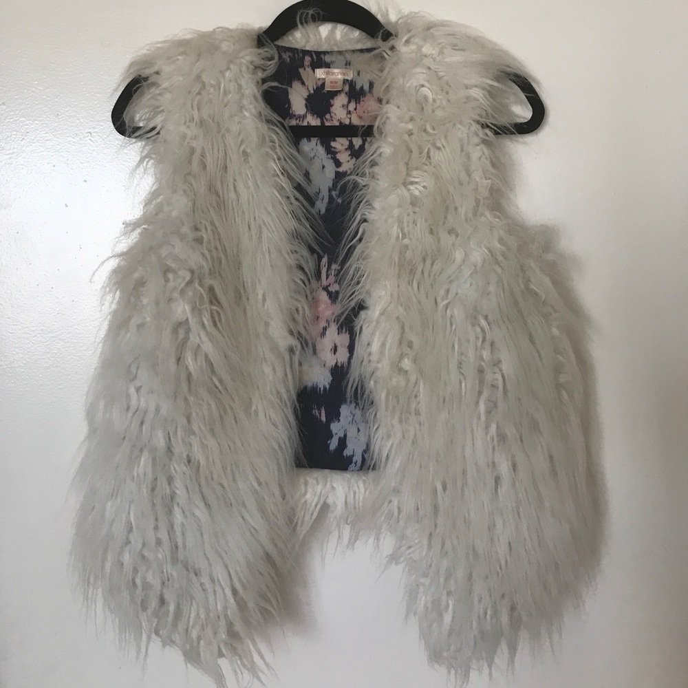 White fur vest