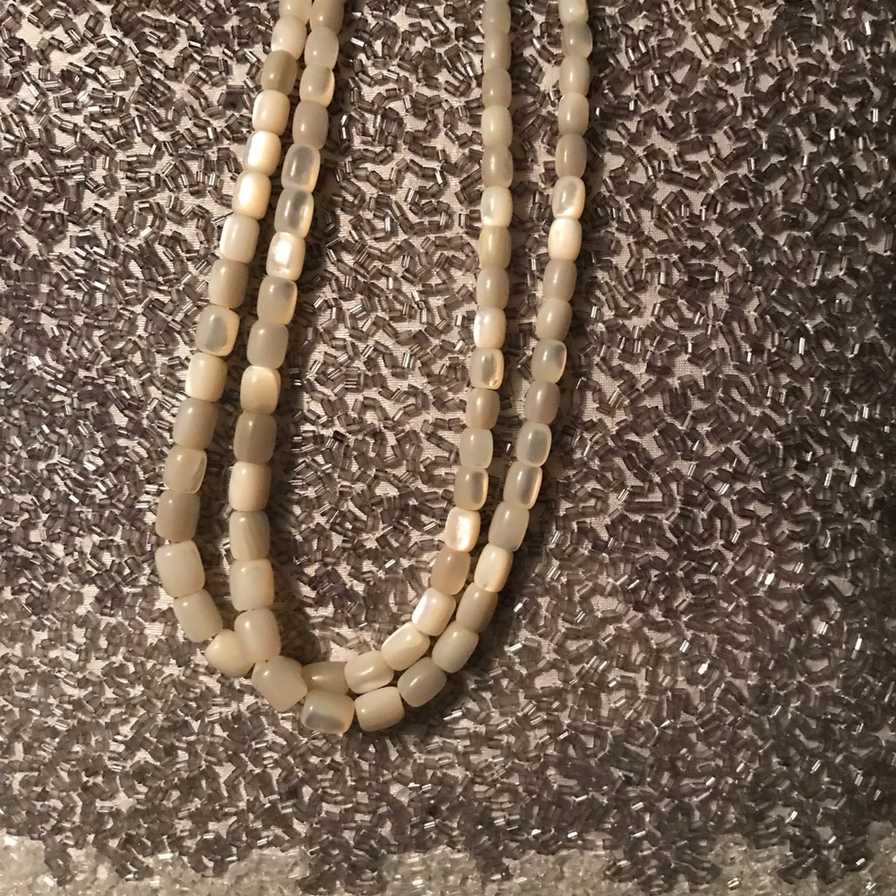 White stone necklace, 22 inches fully laid out.
