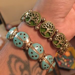 2 bracelets with lady bug & tree of life designs