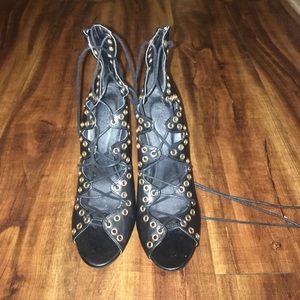 Black pair of lace up shoes