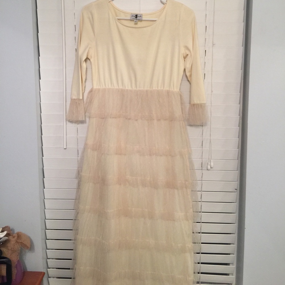 Dainty Jewels cream colored ruffle dress