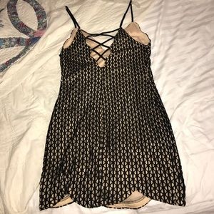 Nude and black mini dress criss cross