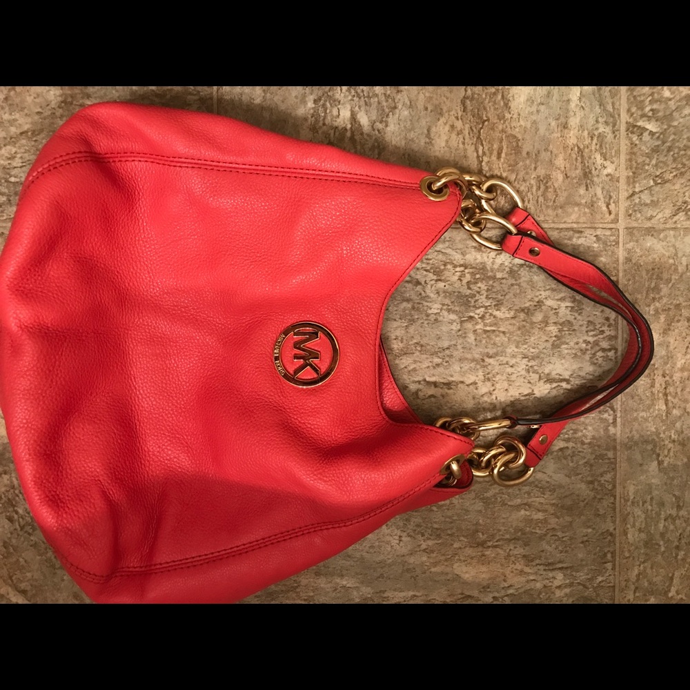 Authentic Michael Kors Coral colored hobo bag.