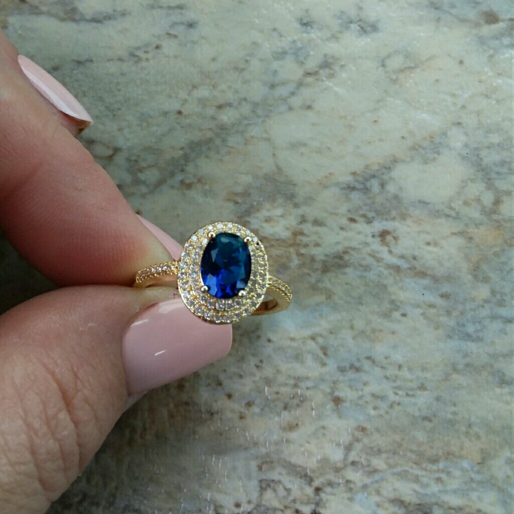 Genuine Blue Oval Solitaire Ring
