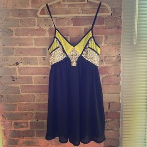 Black, yellow, and gold sequin dress