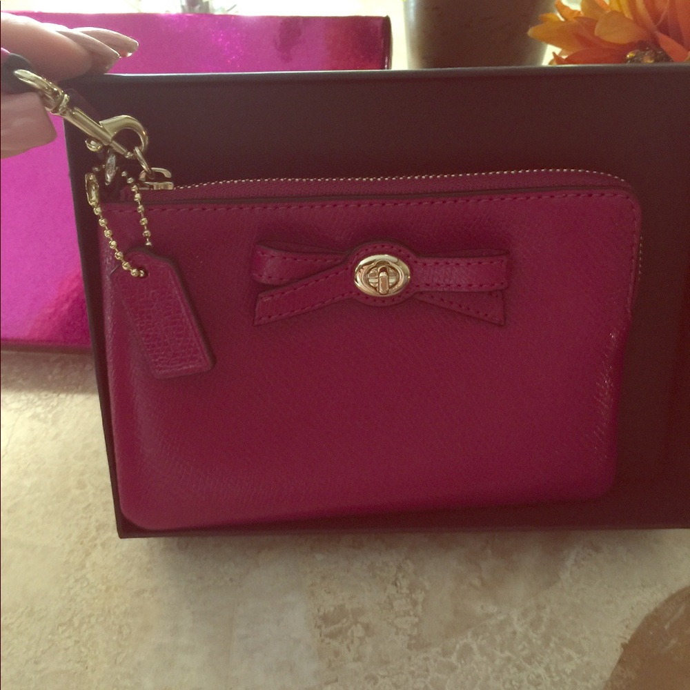 Pink / Fuchsia  Coach wristlet in a gift box