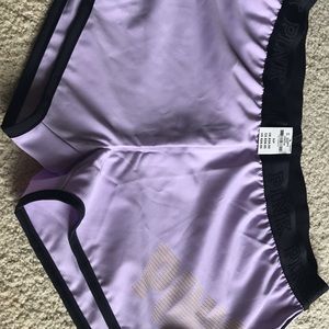 Victoria Secret shorts and sports bra.