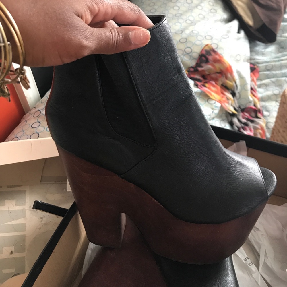 Black leather clogs with wooden heels