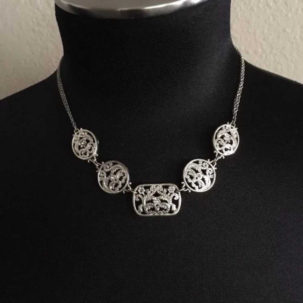 Silver toned leaf flower cutout necklace crystals