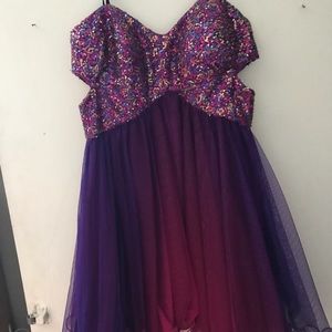 Fun mini party dress it has cut outs on the side