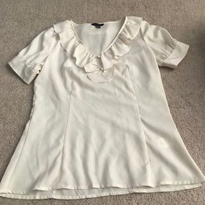 White ruffled top