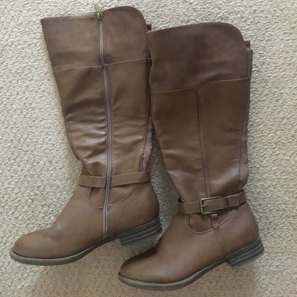 Knee high tan boots.