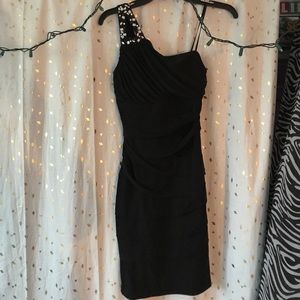 Form fitting one shoulder dress.