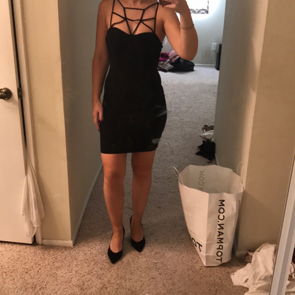 Black mini, bodycon strappy dress.