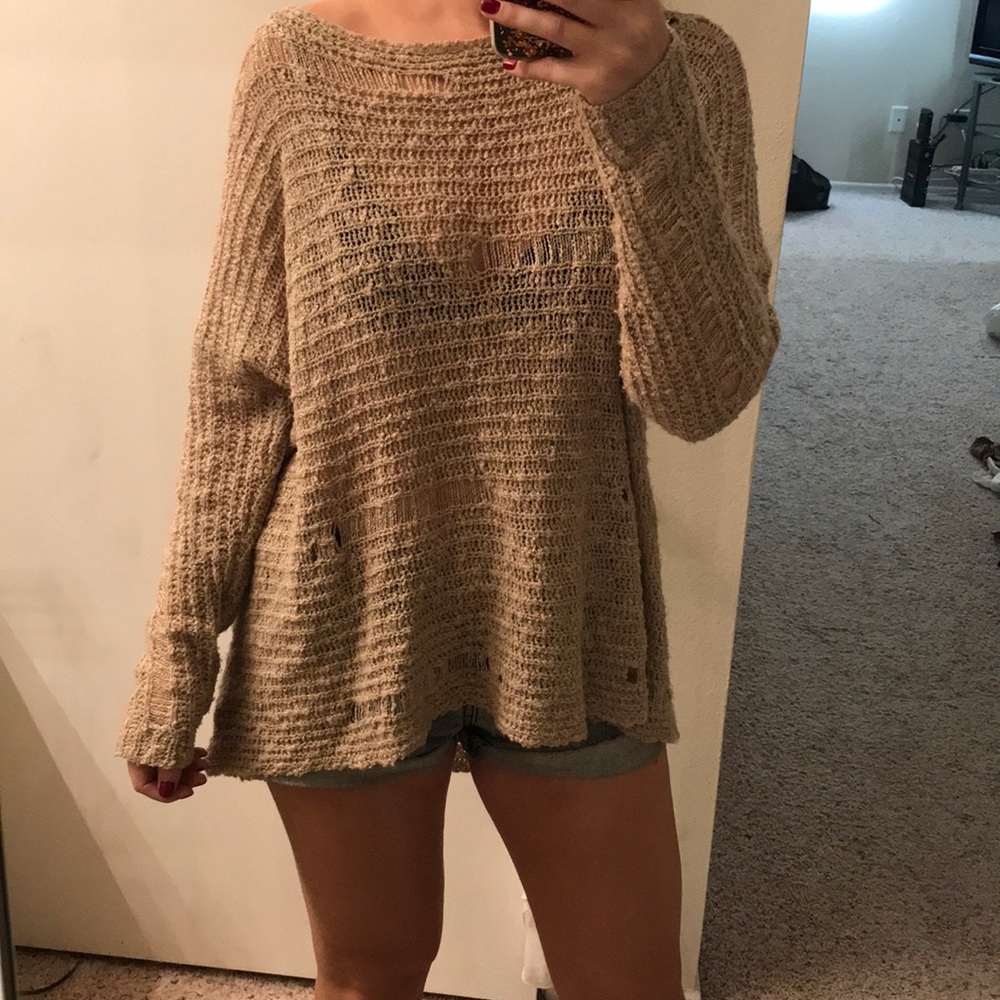 Long Tan, holey sweater.
